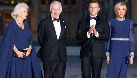 Macron Kisses Queen Camillas Hand As She Arrives At Palace Of