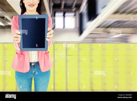 Composite Image Of Elegant Brunette Using Tablet Stock Photo Alamy