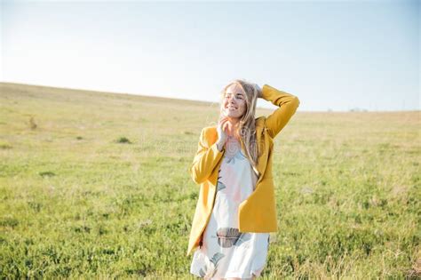 Blonde Woman Walking In Nature On Green Grass In A Field Walking Journey Stock Image Image Of
