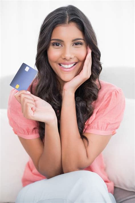 Smiling Cute Brunette Sitting On Couch Showing Credit Card Stock Image Image Of Domicile