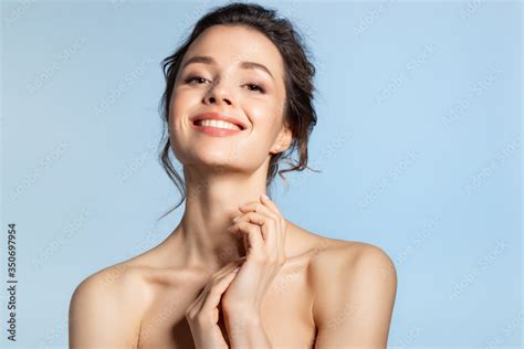 Beautiful Brunette Girl With Glowing Hydrated Facial Skin Touching Healthy Palm Skincare And