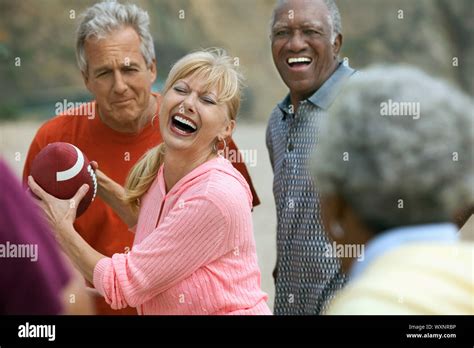 Friends Playing Football Together Stock Photo Alamy