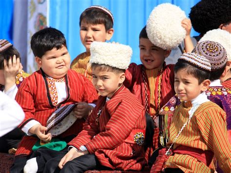 Turkmenistan – Turkmen boys wear traditional clothes at a festival in