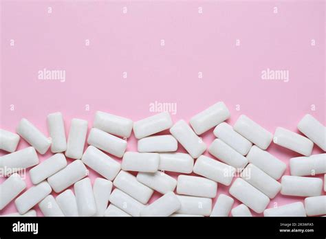 Tasty White Chewing Gums On Pale Pink Background Flat Lay Space For