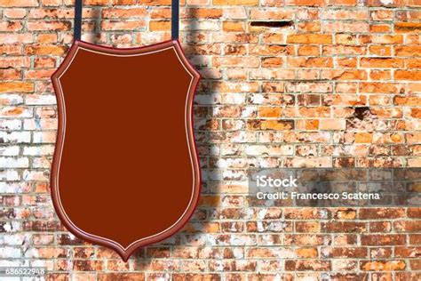 metal red placard    brick wall stock photo