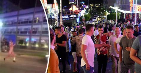 Bizarre Moment Magaluf Tourist Parades Naked Down Street Before Diving Headfirst Into Bin
