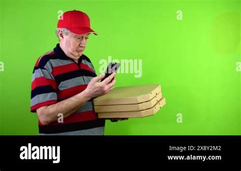 Mature Delivery Man Showing Blank Advertising Display Smartphone And Smiling Mature Worker In
