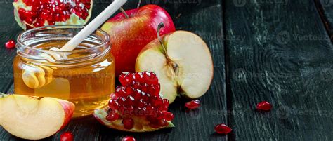 Rosh Hashanah Celebration Jar With Honey Apples And Pomegranates On Dark Wooden Background