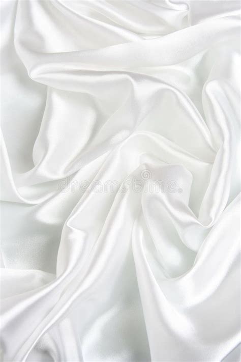 White Satin Background. A background of a rippled smooth satin-like ...