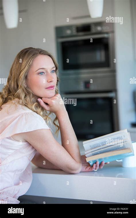 Pretty Blonde Reading A Book Stock Photo Alamy