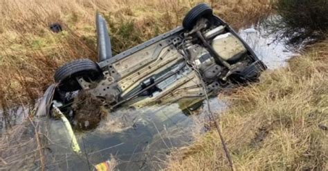 Car Flips Onto Roof And Lands In Water Filled Ditch In Horror Crash