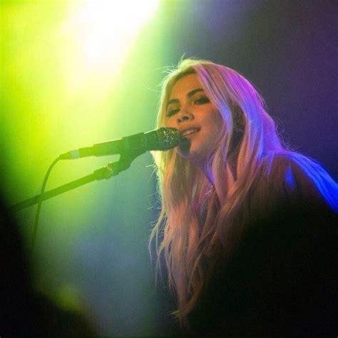 Singer With Long Blonde Hair Performing In Seattle