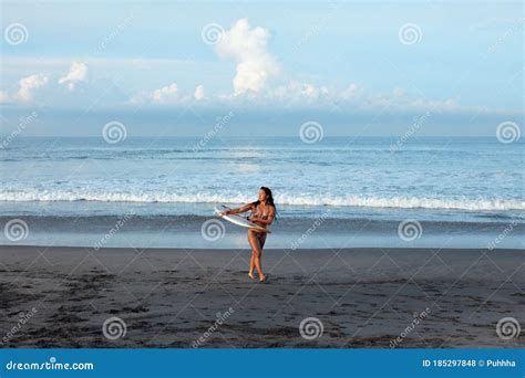 Beautiful Surfer Girl Surfing Woman Walking Out Of Ocean Tanned Brunette Carrying Surfboard On