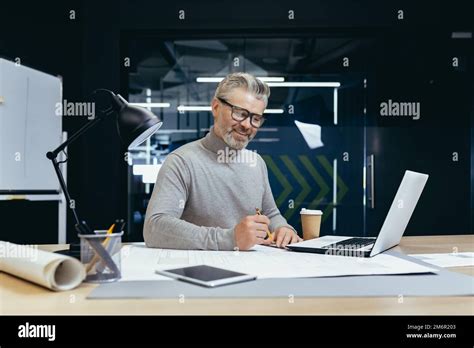 Successful Senior Architect At Work In Office Mature Gray Haired Man