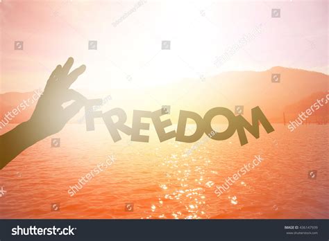 Silhouette Hand Holding Freedom Paper Text Stock Photo 436147939
