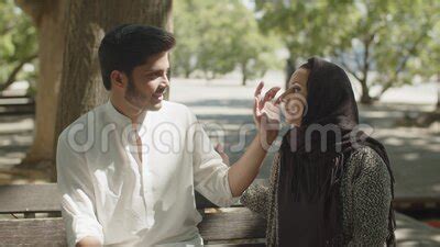 Lovely Muslim Couple Sitting On Bench In Park On Hot Summer Day Stock Video Video Of Adult