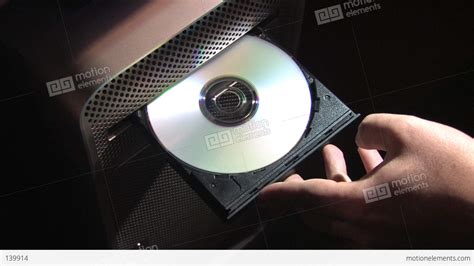 Inserting Compact Disc Into Computer Stock Video Footage 139914