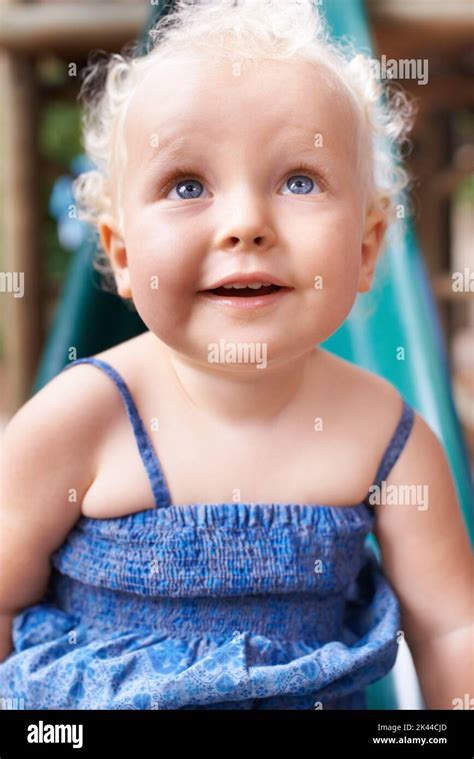 Newborn Baby With Blonde Hair And Blue Eyes