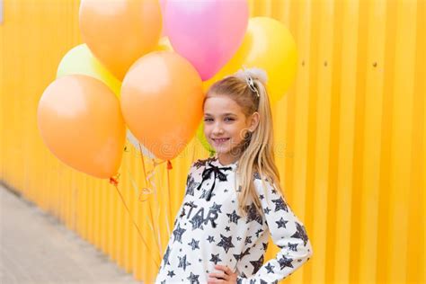 Portrait Of A Beautiful Blonde Girl With Gel Colored Balls On A Stock Photo Image Of Rest