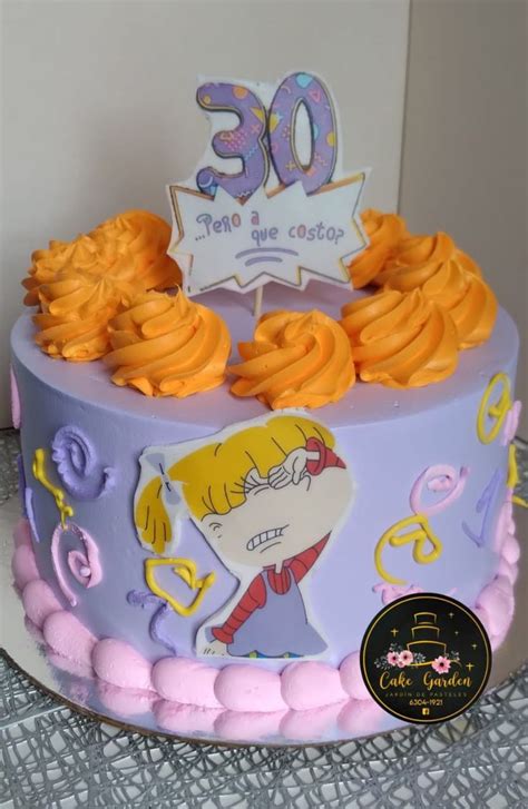 A Birthday Cake Decorated With Cartoon Characters And Decorations