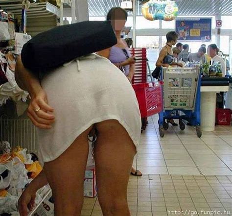 Inside A Shop In A Short Dress And Showing Her Pussy And Pussy Ring