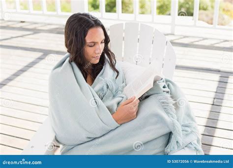 Pretty Brunette Sitting On A Chair And Reading A Book Stock Photo Image Of Casual Calm