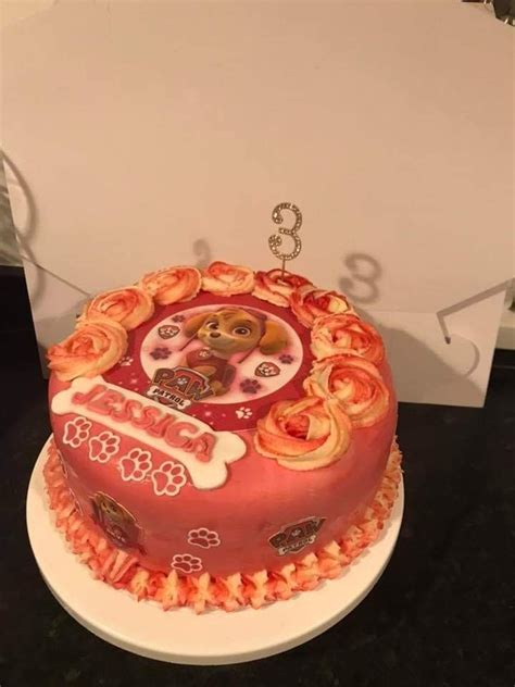 A Decorated Cake Sitting On Top Of A Table