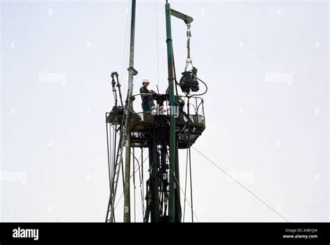 Men working on derrick drilling rig oil exploration industry in Dhahran ...