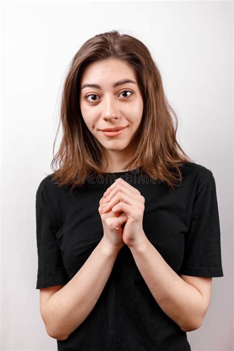 Happy Brunette Woman Smiling While Looking At Camera On A White