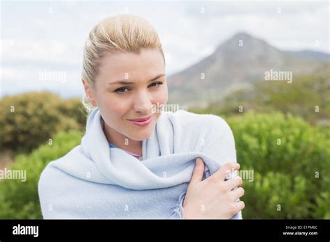 Pretty Blonde Wrapped Up In Blanket Outside Stock Photo Alamy