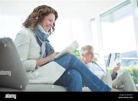 Smiling Mature Woman By Man Using Digital Tablet Stock Photo Alamy