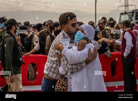 A Kashmiri Muslim Pilgrim Is Hugged By A Relative A She Leaves For The