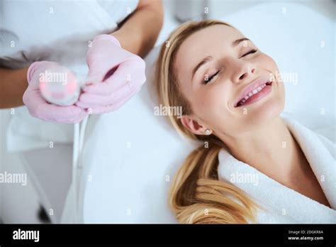 Attractive Blonde Patient Smiling Before The Cosmetic Procedure Stock Photo Alamy