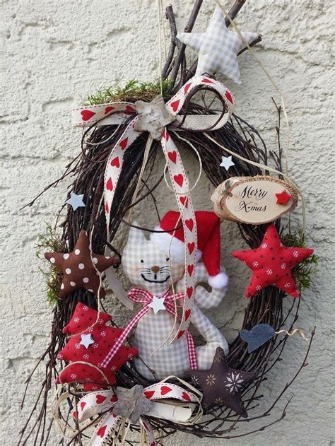 A Christmas Wreath With A Teddy Bear And Other Decorations