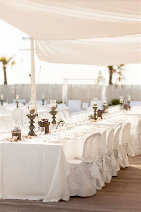 Beach-Themed White Dining Table with Succulents and Sand