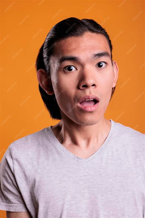 Premium Photo Surprised Young Adult Asian Man Facial Expression Close