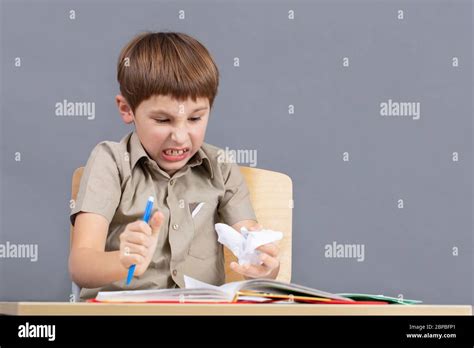 The Child Is Angry At Homework An Elementary School Student Is Tearing