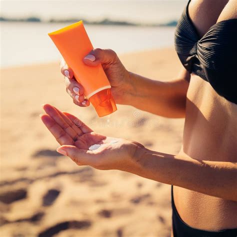Woman Hands Putting Sunscreen From A Suntan Cream Bottle Tanned Girl Wearing Black Bikini