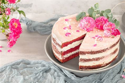 Red Velvet Naked Cake With Fresh Roses And Swiss Buttercream On Kitchen