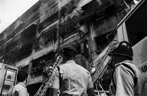 People Rescuing People In Building Photo Free Current Events Image On