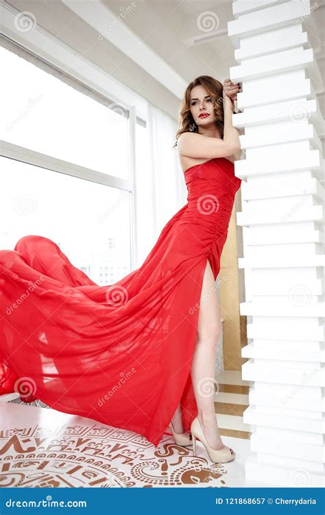 Beautiful Brunette Woman In A Red Dress Fashion Beauty Portrait Stock