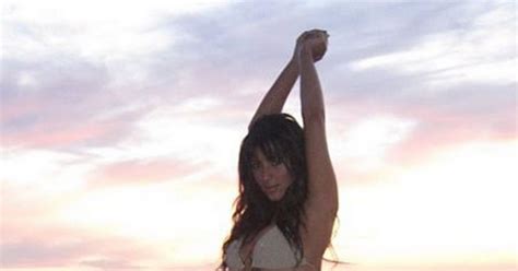 Kim Kardashian Shows Off The Curves Which Bagged Kanye West As She Poses In Her Bikini Ok