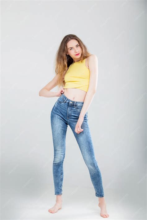 Premium Photo Young Beautiful Girl Model In Skinny Jeans And Top In