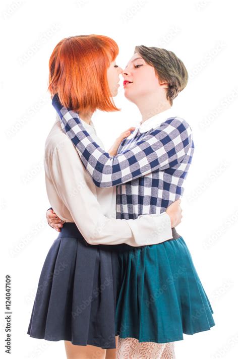 Two Lesbian Girls Hugging And Kissing On The Lips On White Isolated Background Stock Photo