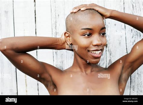 Close Up Of Naked Black Woman Rubbing Bald Head Stock Photo Alamy