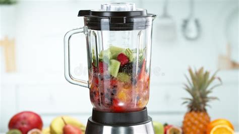 Fresh Fruit and Vegetables Smoothie Blended in Blender, Side View Stock ...