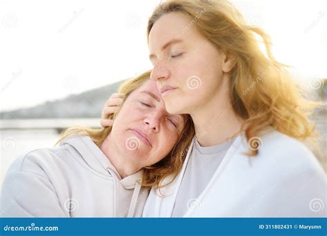 Cute Woman Tenderly Hugs Her Mature Mother On Mother S Day Stock Image Image Of Elderly