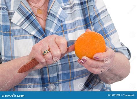 Peeling an orange stock photo. Image of wrinkles, woman - 15939262