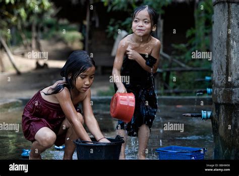Luang Prabang Laos Young Girls Washing With Buckets Stock Photo Alamy