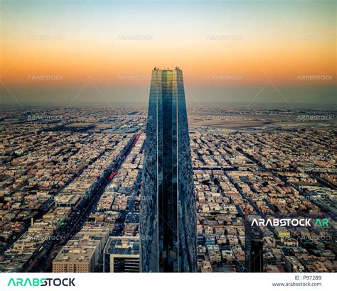 A side view of the Kingdom Tower, the towers and skyscrapers, the roads ...